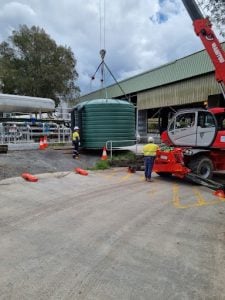 Crane delivering water tank